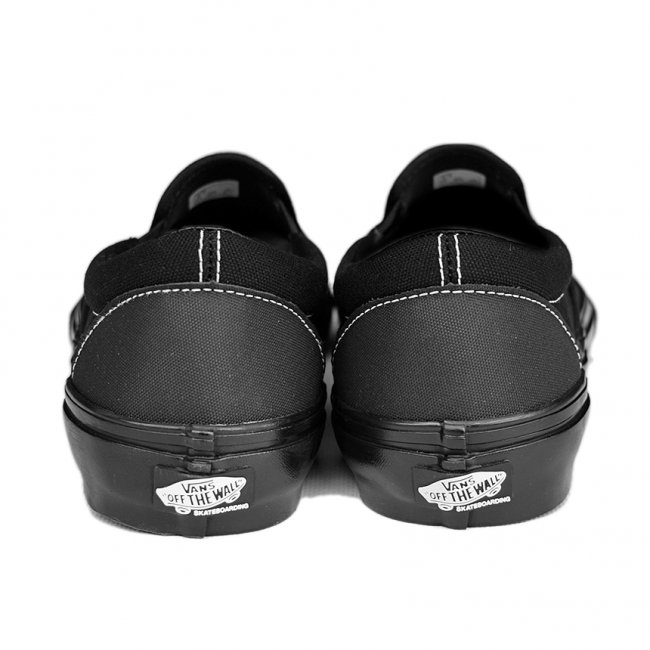 Vans black on black hotsell slip on