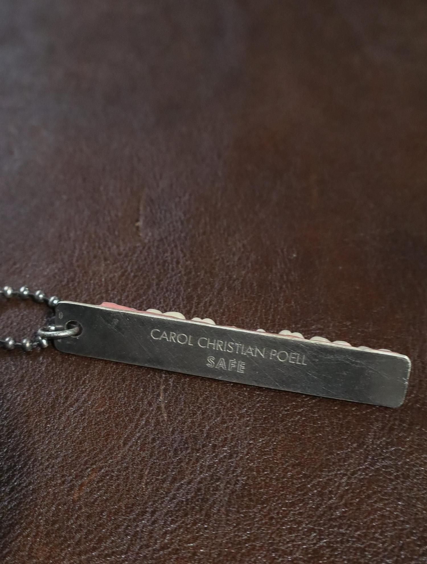 SILVER PENDANT WITH EIGHT RESERVE TEETH / CAROL CHRISTIAN POELL